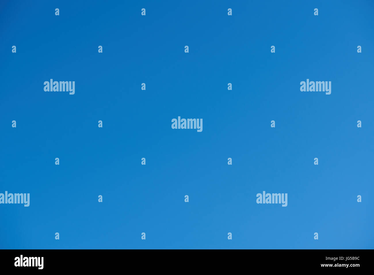 Blue clean sky background. Deep blue sky with no clouds day time Stock