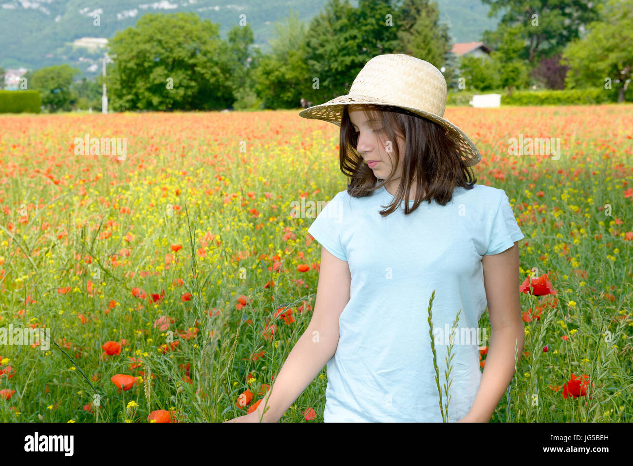 a young teenage girl in poppy field Stock Photo - Alamy