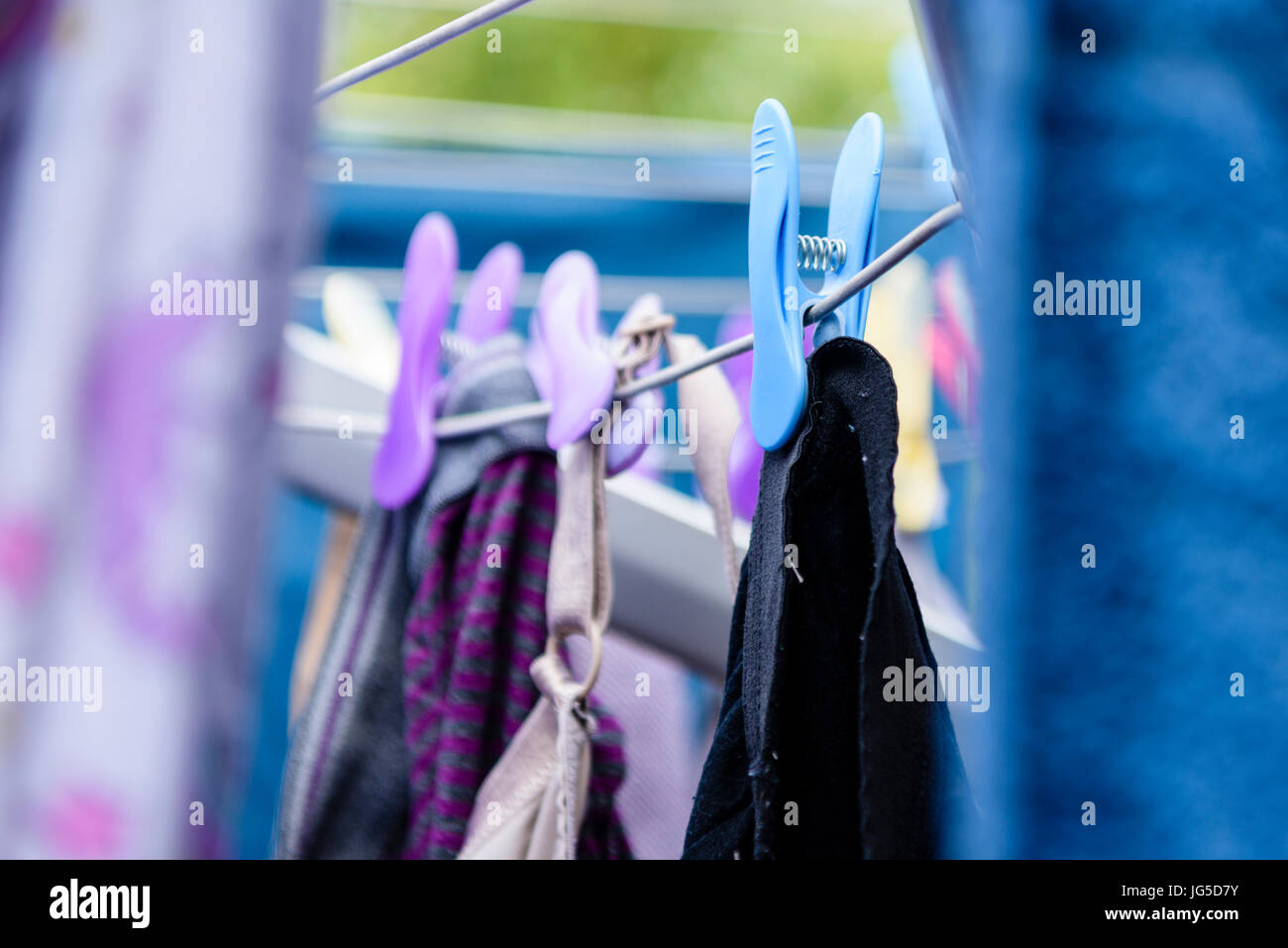 Clothes hanging out to dry in the sun on a washing line. Stock Photo