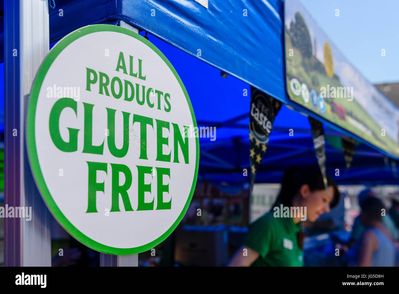 A sign at a market stall advising customers that all their products are Gluten Free Stock Photo