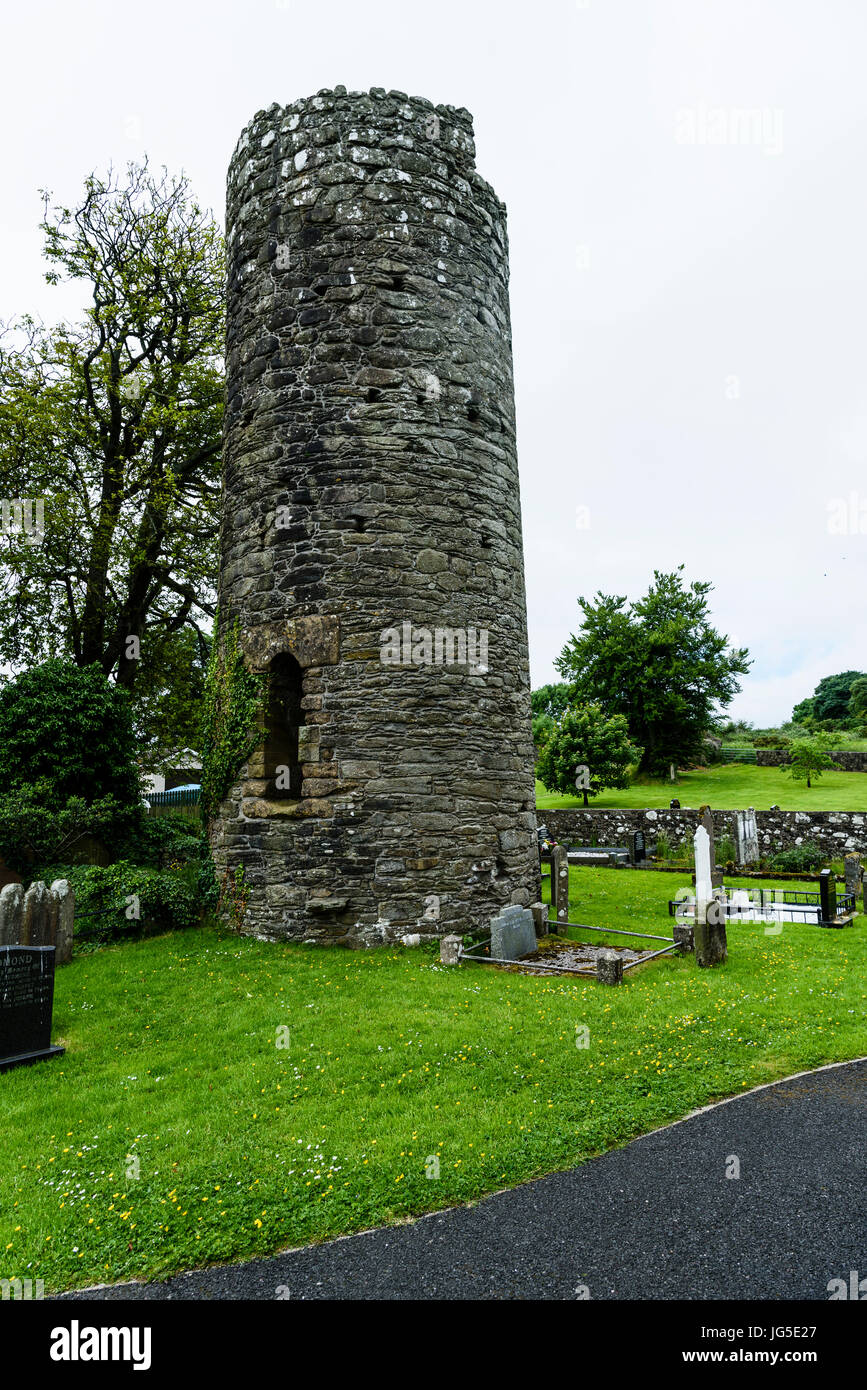 Armoy roundtower in a graveyard. Stock Photo