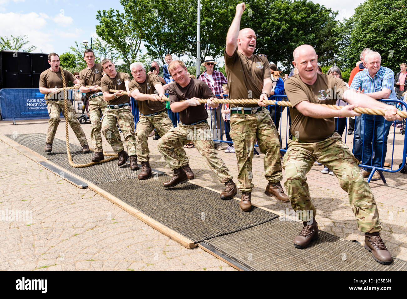 Soldiers take part in a tug-o-war strength test. Stock Photo