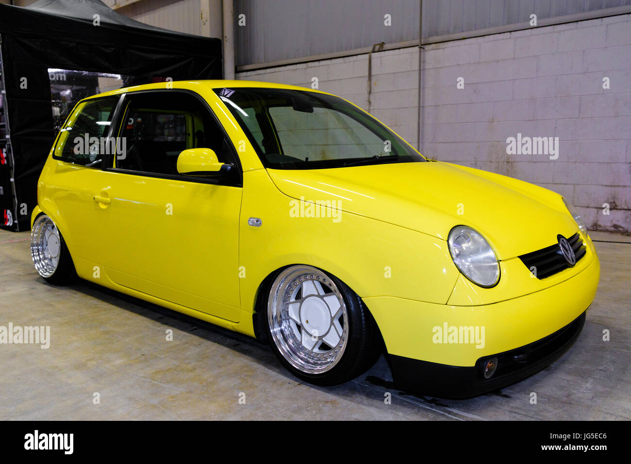 Yellow performance Volkswagen Lupo with lowered suspension Stock Photo