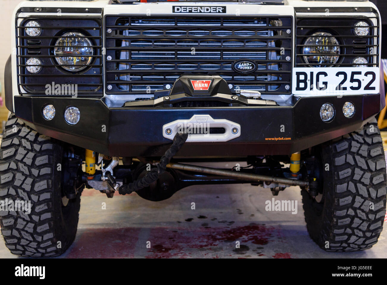 Front of a Landrover Defender 4x4 all four wheel drive off road vehicle with Warn winch Stock