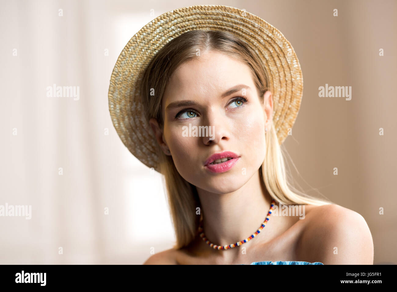 close up portrait of beautiful young woman in straw hat Stock Photo - Alamy