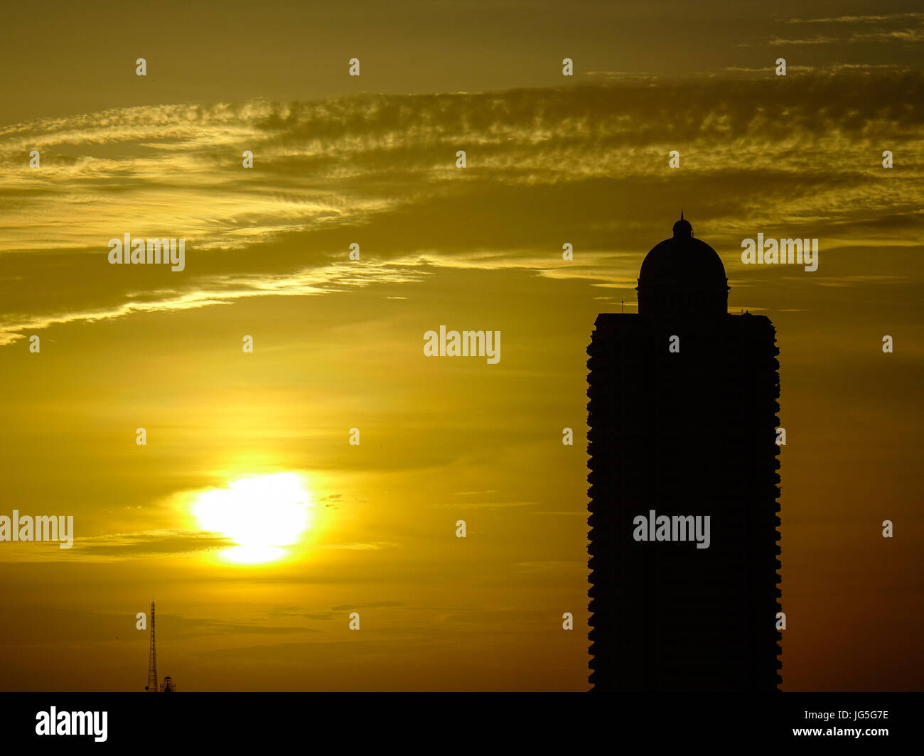Top of a modern building at sunset with many clouds in summer time ...