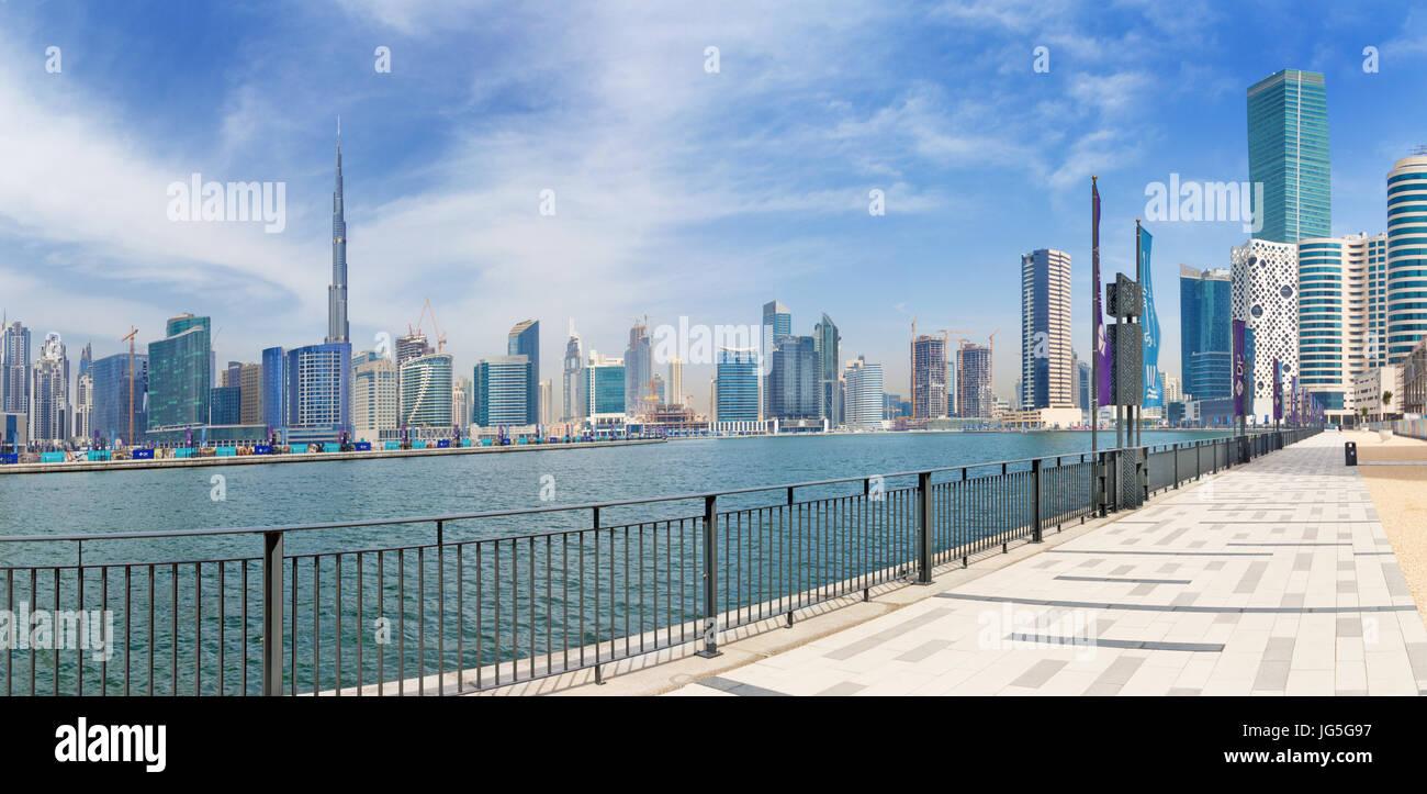 DUBAI, UAE - MARCH 29, 2017: The skyline over the new Canal and Downtown and the promenade. Stock Photo