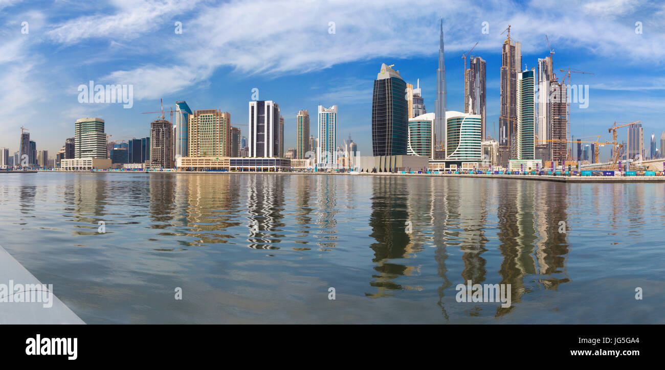 DUBAI, UAE - MARCH 29, 2017: The skyline with the bridge over the new Canal and Downtown and Burj Khalifa tower. Stock Photo