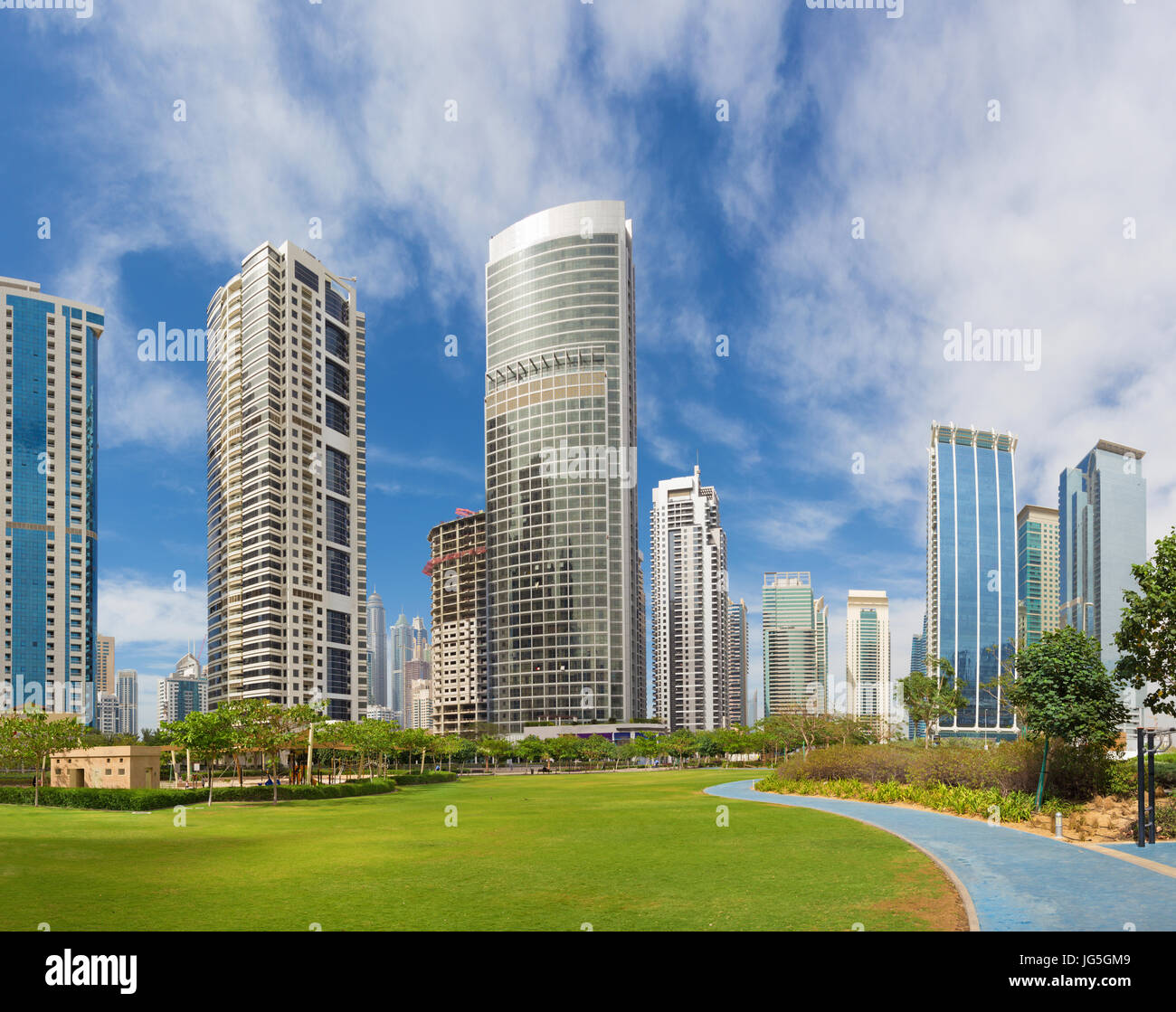 Dubai - The park and The Jumeirah lake towers. Stock Photo