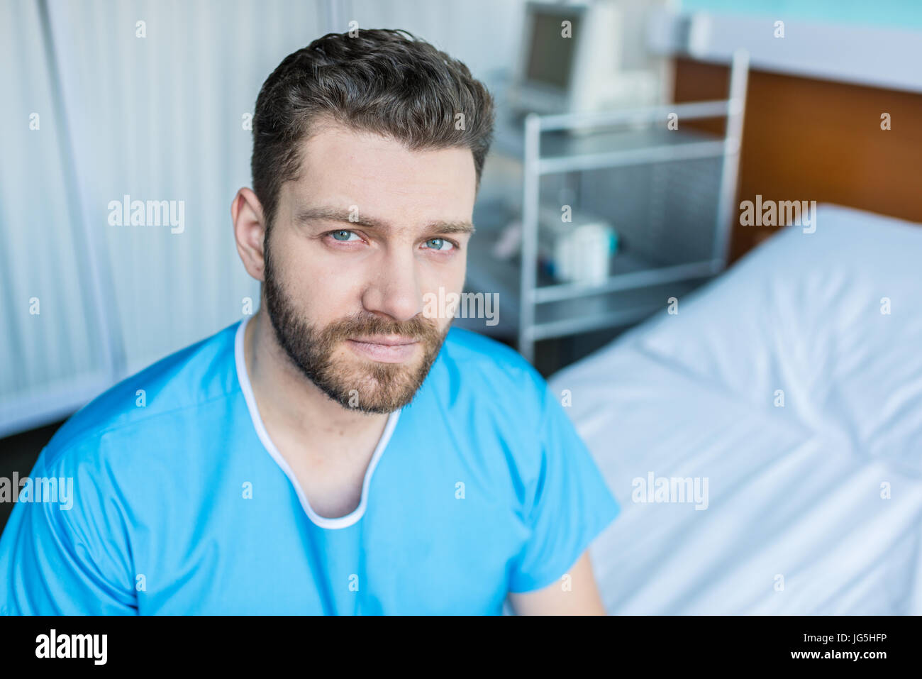 Man sitting on hospital bed hi-res stock photography and images - Alamy