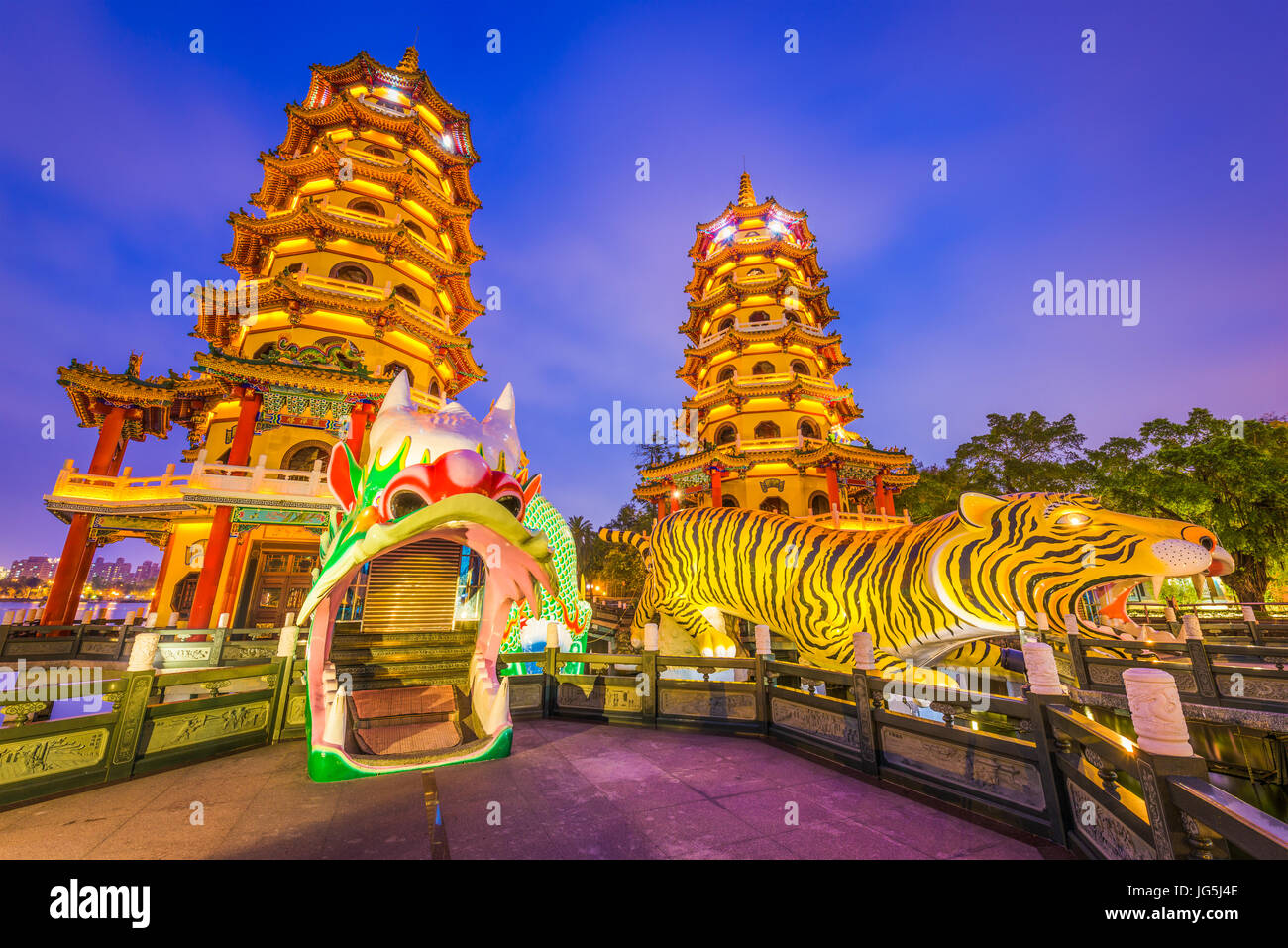 Kaohsiung, Taiwan Lotus Pond's Dragon and Tiger Pagodas at night. Stock Photo