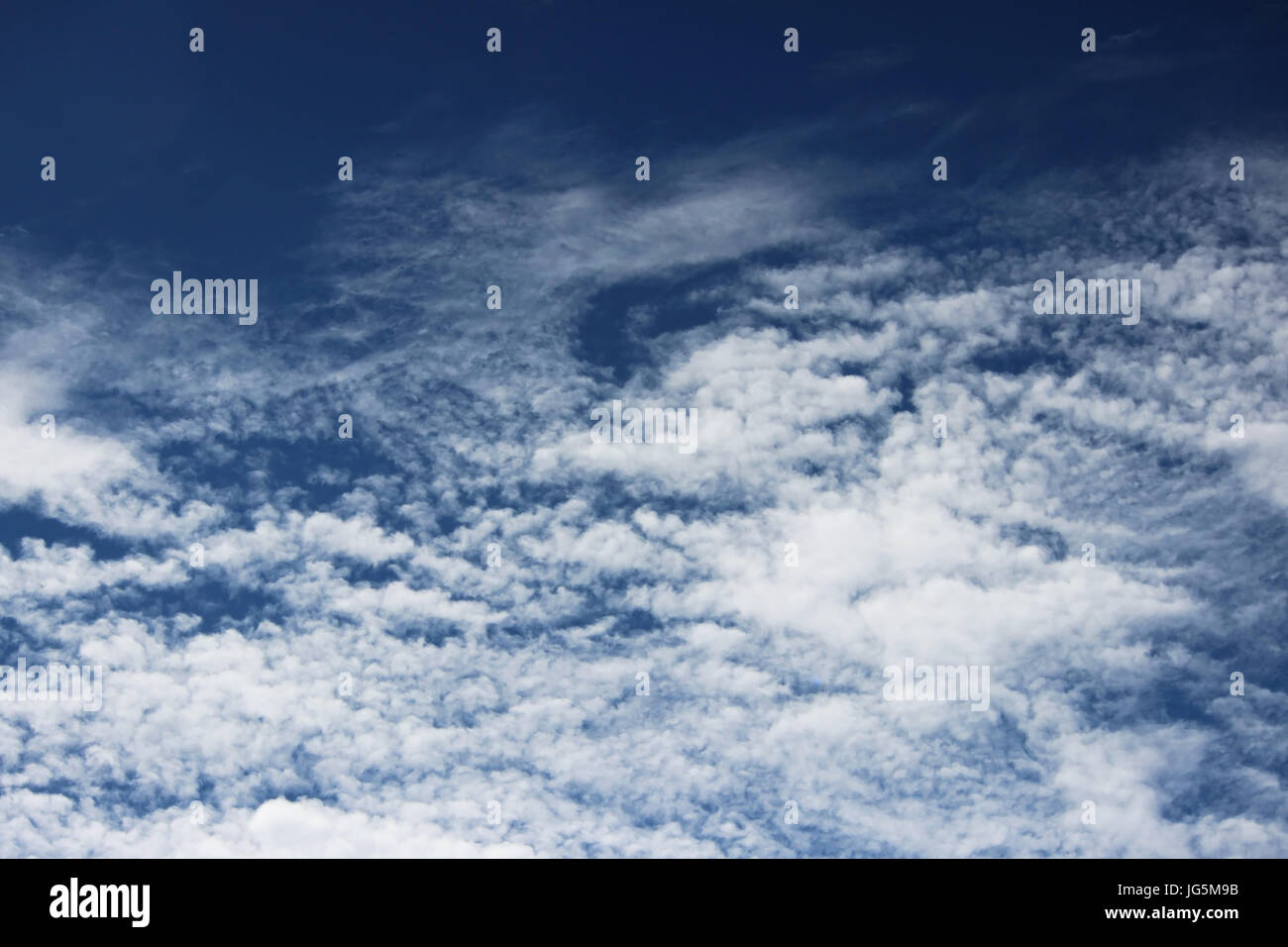 white clouds against the blue sky on a sunny summer day Stock Photo - Alamy