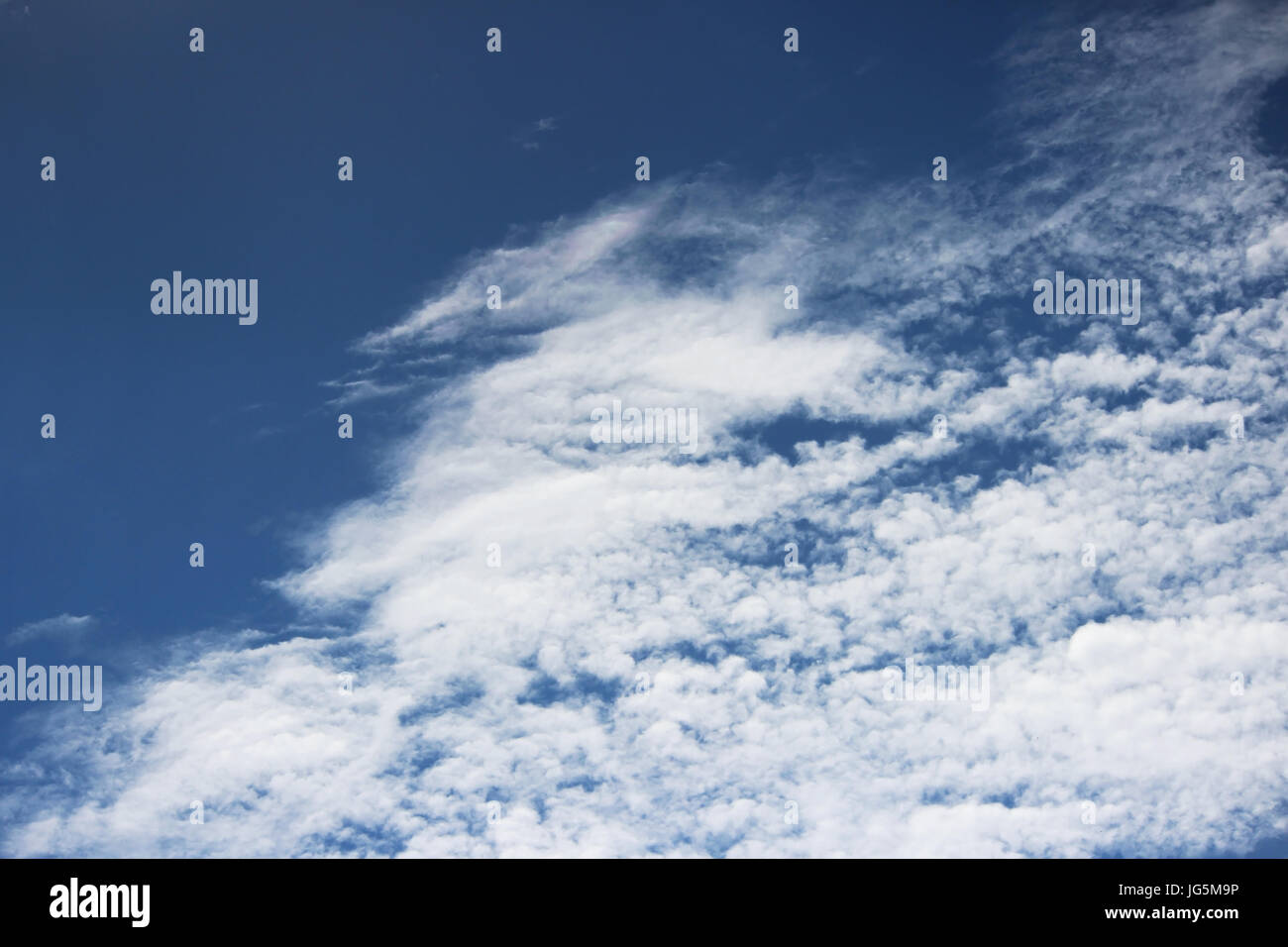 white clouds against the blue sky on a sunny summer day Stock Photo - Alamy