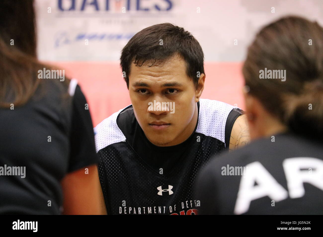 U.S. Army veteran Jarred Vaina, American Samoa, listens to instructions during a sitting volleyball match with Special Operations Command, June 30, at McCormick Place Convention Center, Chicago, Illinois, for the 2017 Department of Defense Warrior Games. The DOD Warrior Games are an adaptive sports competition for wounded, ill and injured service members and veterans. Approximately 265 athletes representing teams from the Army, Marine Corps, Navy, Air Force, Special Operations Command, United Kingdom Armed Forces, and the Australian Defence Force will compete June 30 – July 8 in archery, cycli Stock Photo