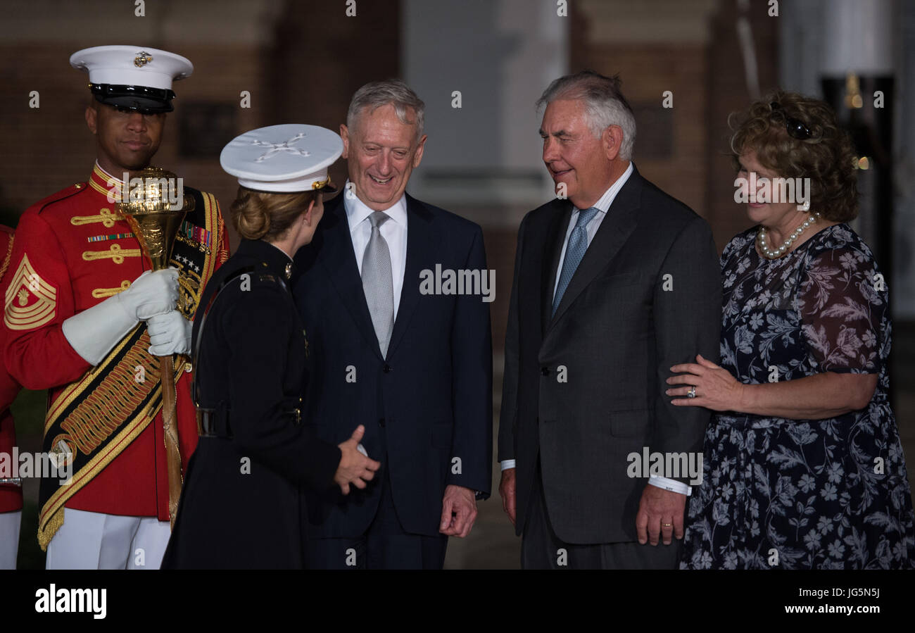 Defense Secretary Jim Mattis stands with State Secretary Rex Tillerson and his wife Renda Tillerson following a sunset parade at the Marine Barracks Washington in Arlington, Va., June 30, 2017. (DOD photo by U.S. Army Sgt. Amber I. Smith) Stock Photo
