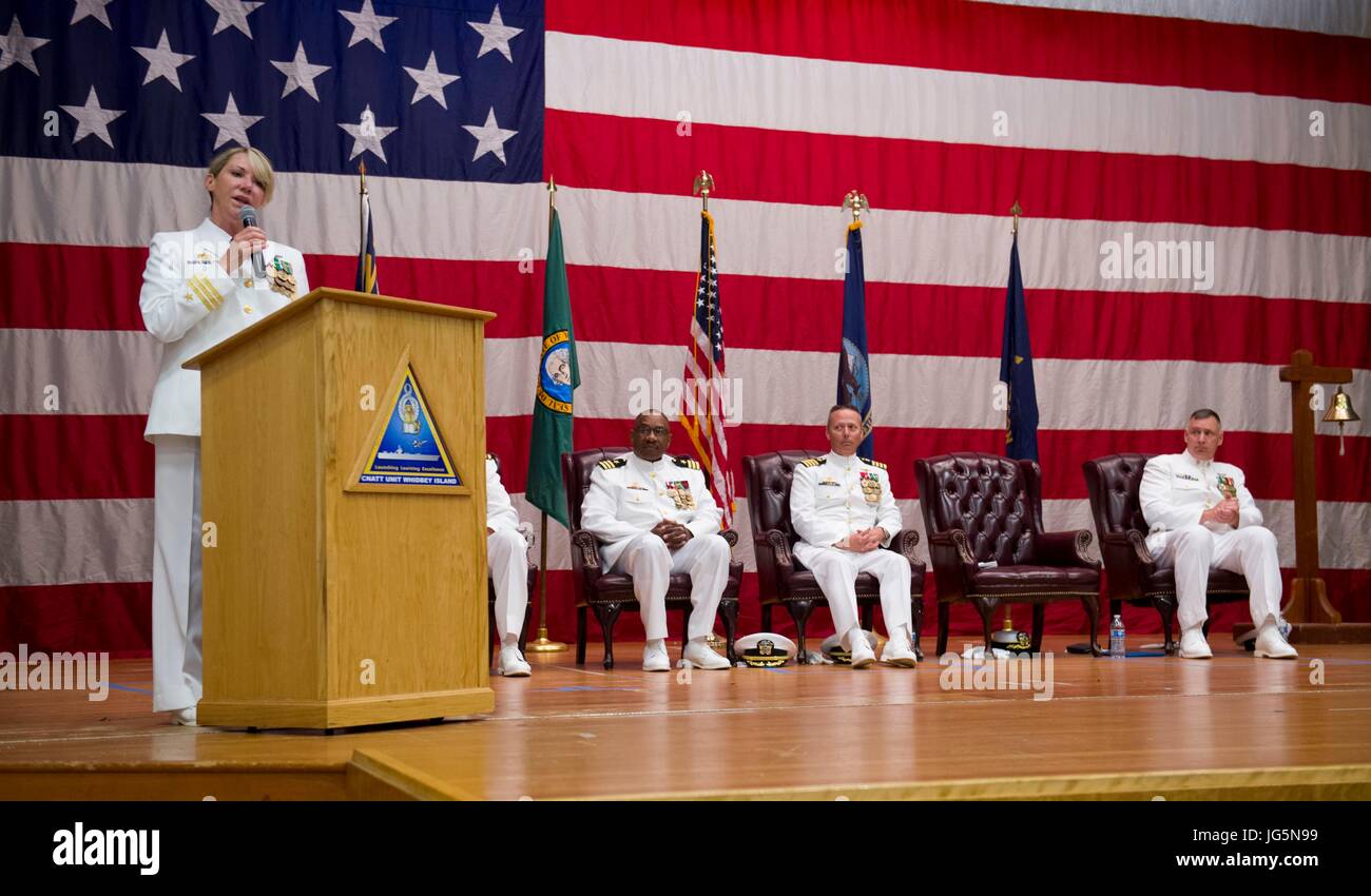170630-N-KH214-224 OAK HARBOR, Wash. (June 30, 2017) Cmdr. Kelly Bishop speaks at the Center for Naval Aviation Technical Training Unit (CNATTU) Whidbey Island change of command ceremony held at Naval Air Station Whidbey Island. Bishop relieved Cmdr. Rodney Moss as commanding officer of CNATTU. (U.S. Navy photo by Mass Communication Specialist 2nd Class Scott Wood/Released) Stock Photo