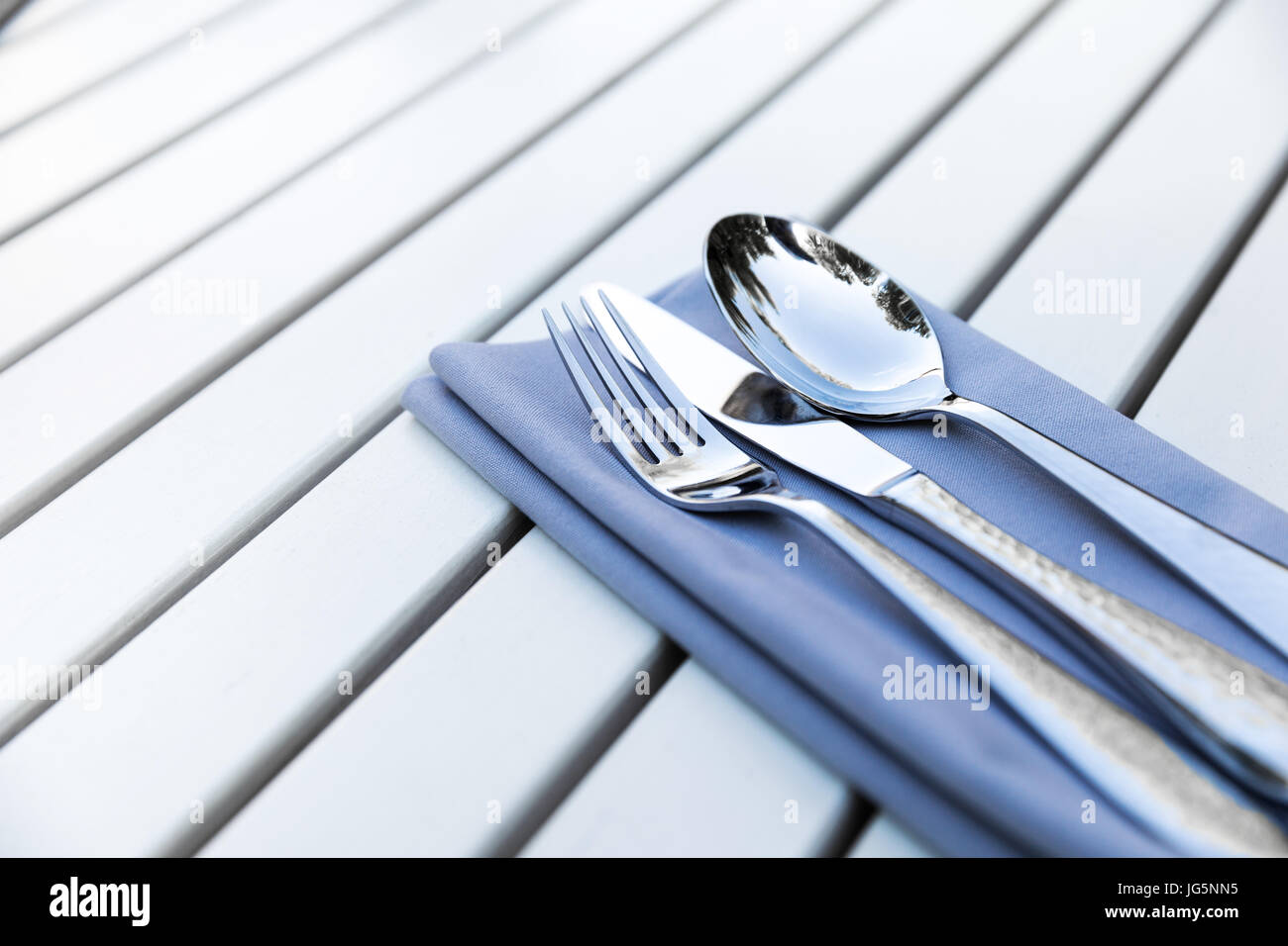 restaurant cutlery on white wooden table with copy space Stock Photo