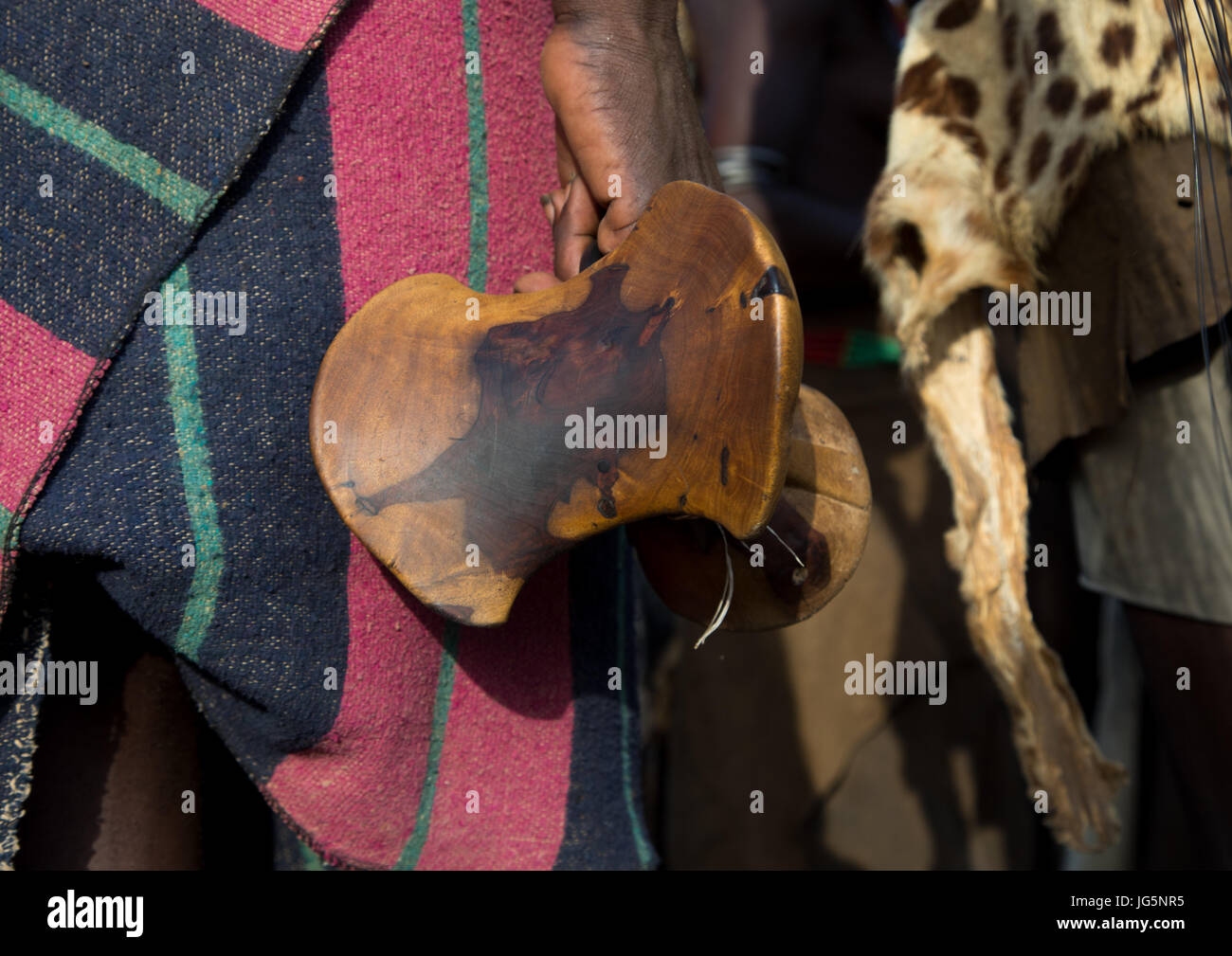 Dassanech tribe man holding his wooden pillow, Turkana County, Omorate, Ethiopia Stock Photo