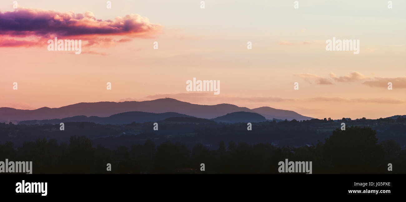 Sunset over Gorce mountains in southern Poland, taken from Nowy Sącz Stock Photo