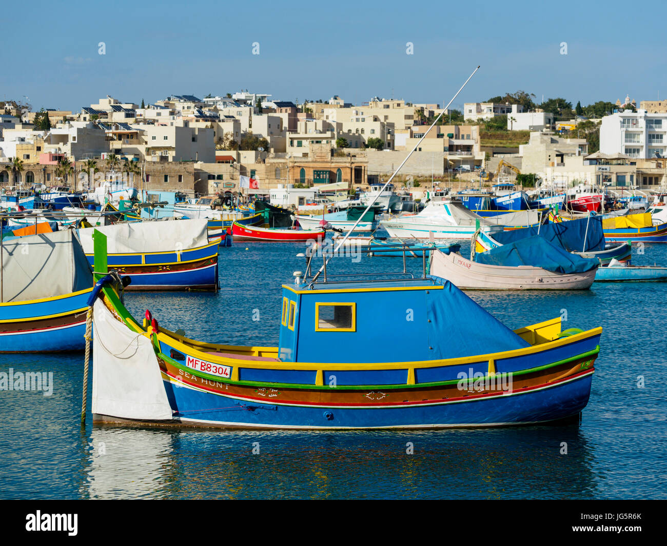 Malta: Colourfull fishing boats in the Marsaxlokk harbour Stock Photo