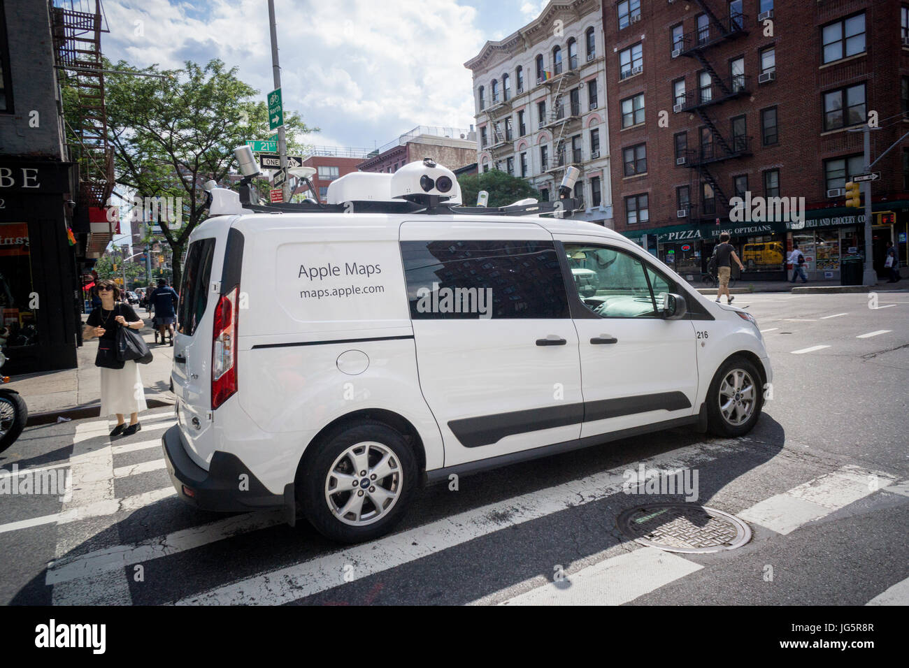 An Apple Maps Car cruises through the New York neighborhood of Chelsea recording everything in its wake on Tuesday, June 27, 2017. Apple is collecting data for updates of its Apple Maps app and blurs license plates and faces to protect privacy.   (© Richard B. Levine) Stock Photo