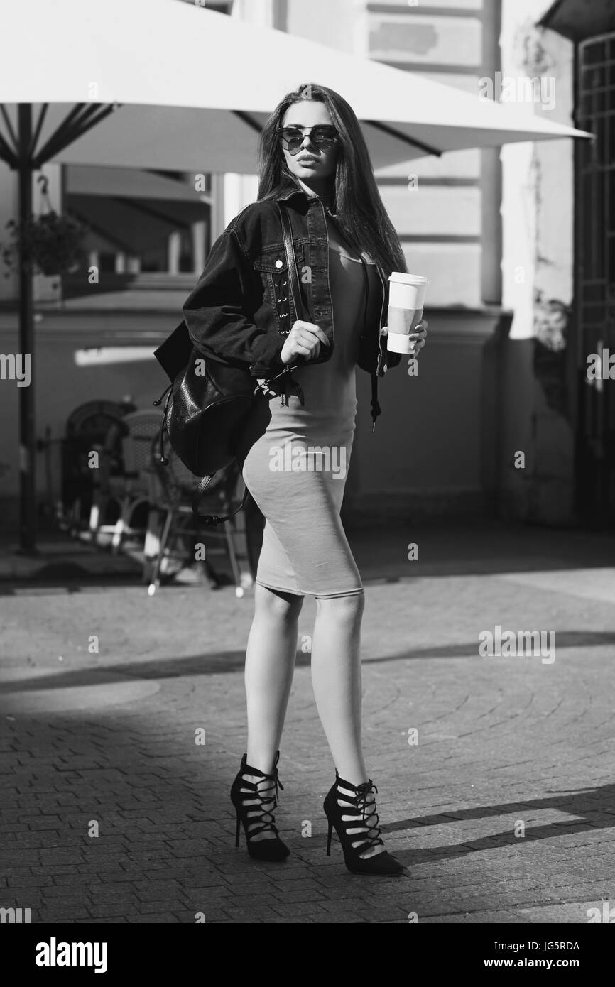 Stylish girl walking in city Stock Photo - Alamy