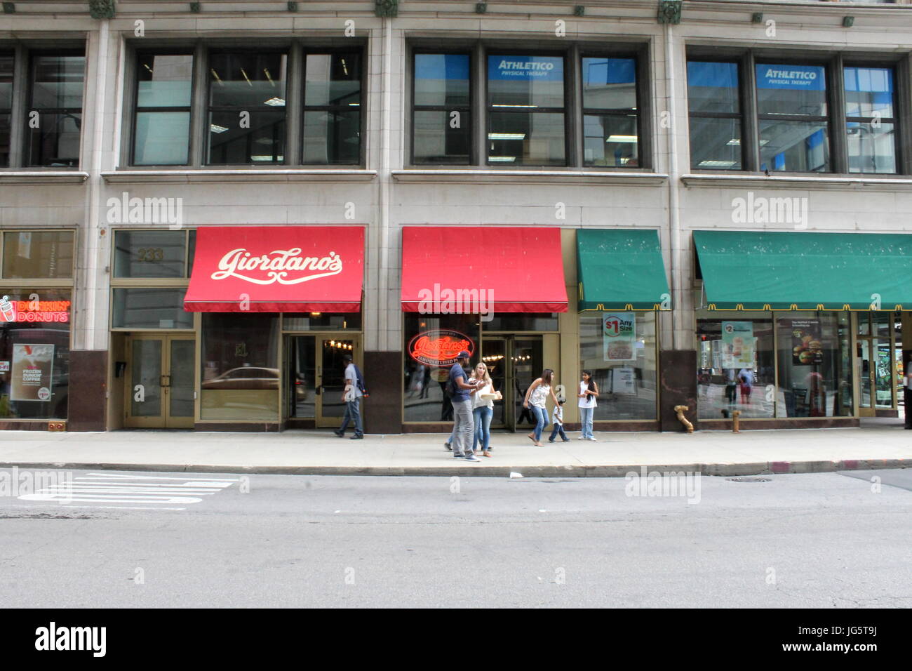 A city street in Chicago IL. Giordano's Pizza storefront Stock Photo