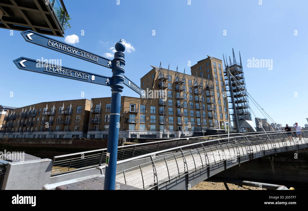 Pedestrian bridge over an inlet of the river Thames, Narrow Street, Limehouse, Tower Hamlets, London, UK Stock Photo