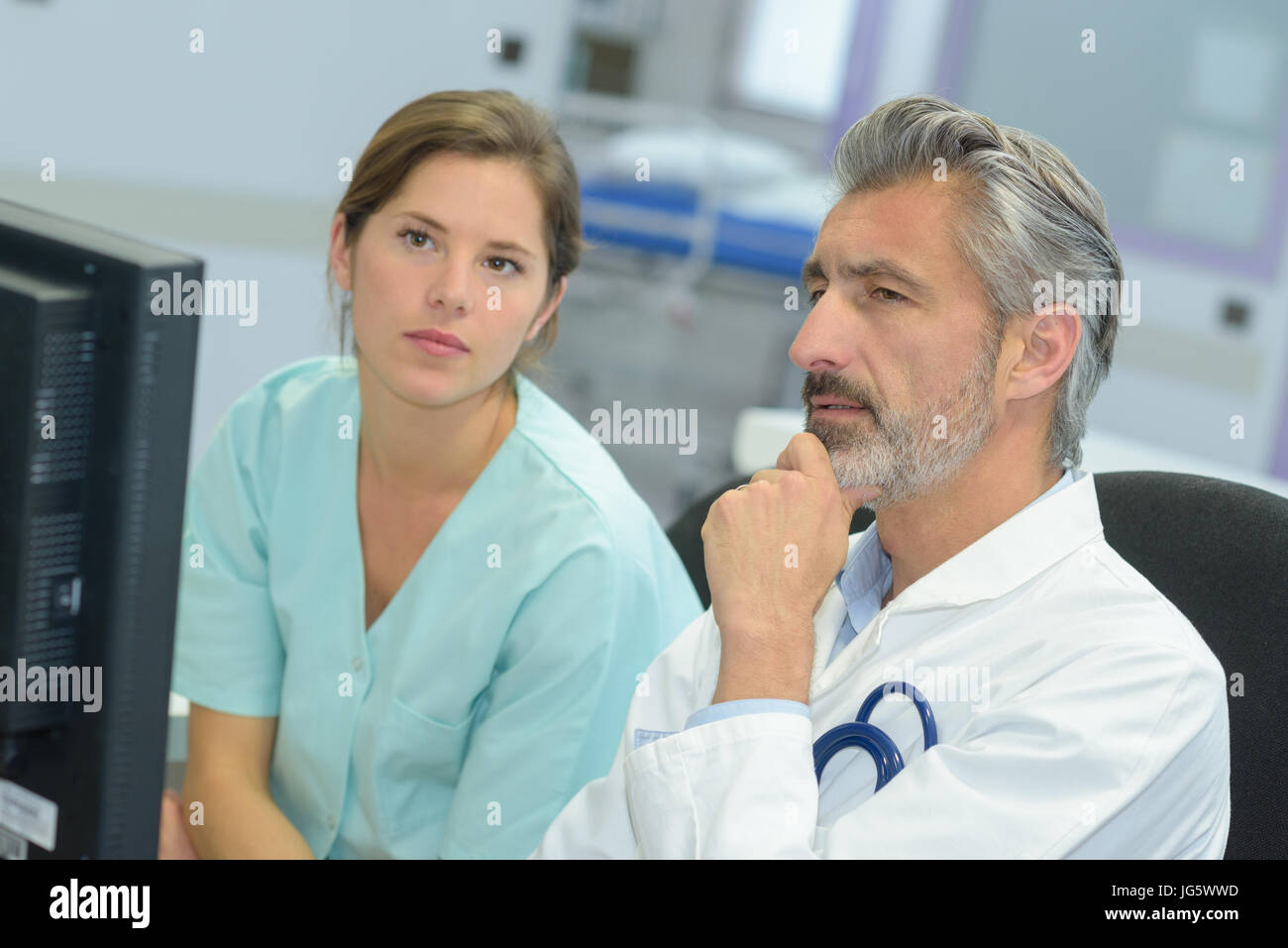 Doctor talking pretty nurse hi-res stock photography and images - Alamy