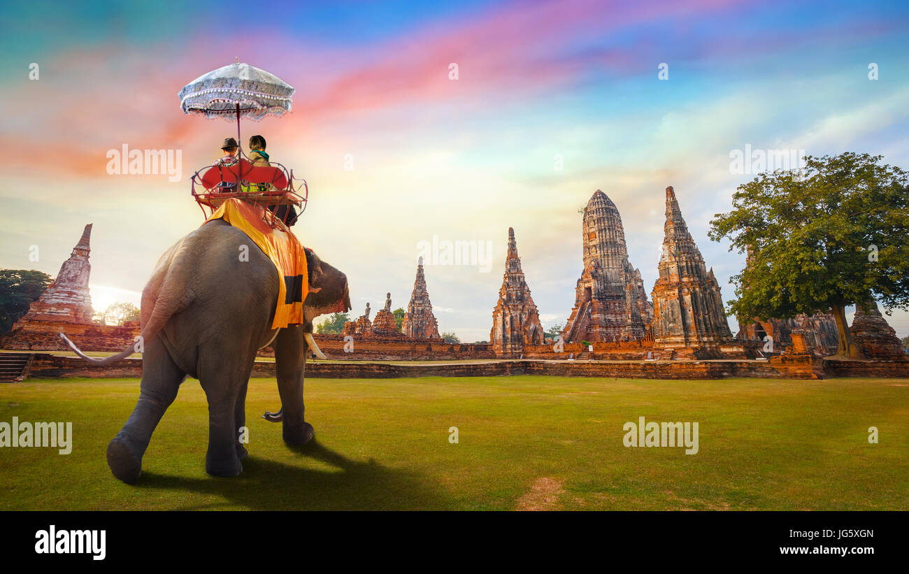 Tourist with Elephant at Wat Chaiwatthanaram temple in Ayuthaya Historical Park, a UNESCO world heritage site Stock Photo