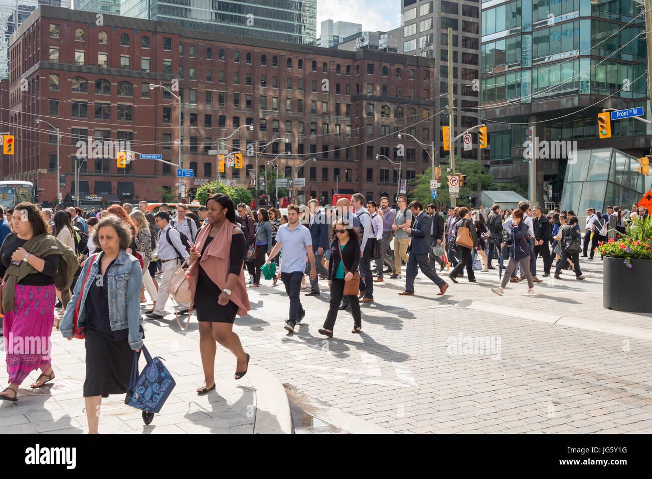 Toronto, Canada - 26 June 2017: A crowd of people crossing Front street in Downtown Toronto Stock Photo