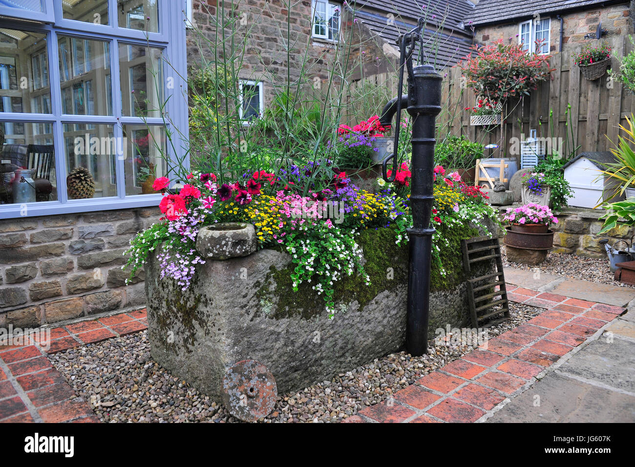 Stone Trough Flower Display Barlow Derbyshire England UK Stock Photo