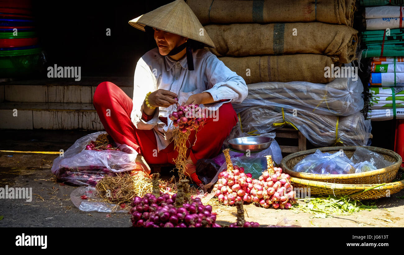 The traders, vendors, hawkers, architecture, landmarks and tourists of Hoi An, Vietnam Stock Photo