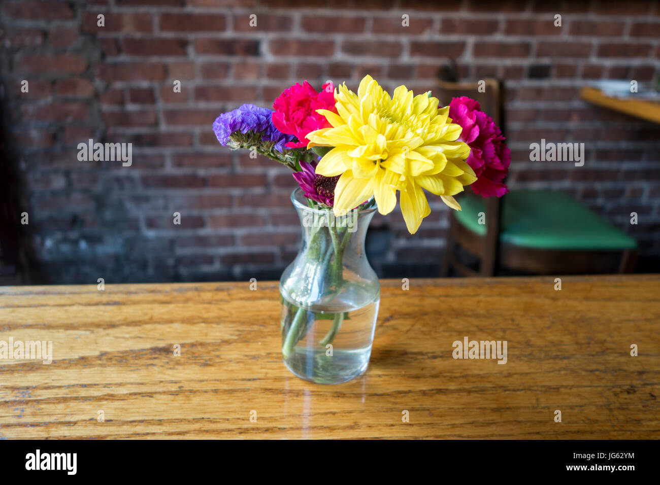 flowers class vase on restaurant table Stock Photo