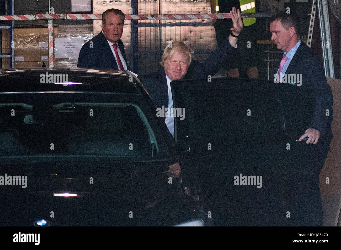 Foreign Secretary Boris Johnson waves to the waiting media after speaking at the launch of Stonewall's Global Workplace Equality Index at the Andaz Hotel in the City of London. Stock Photo