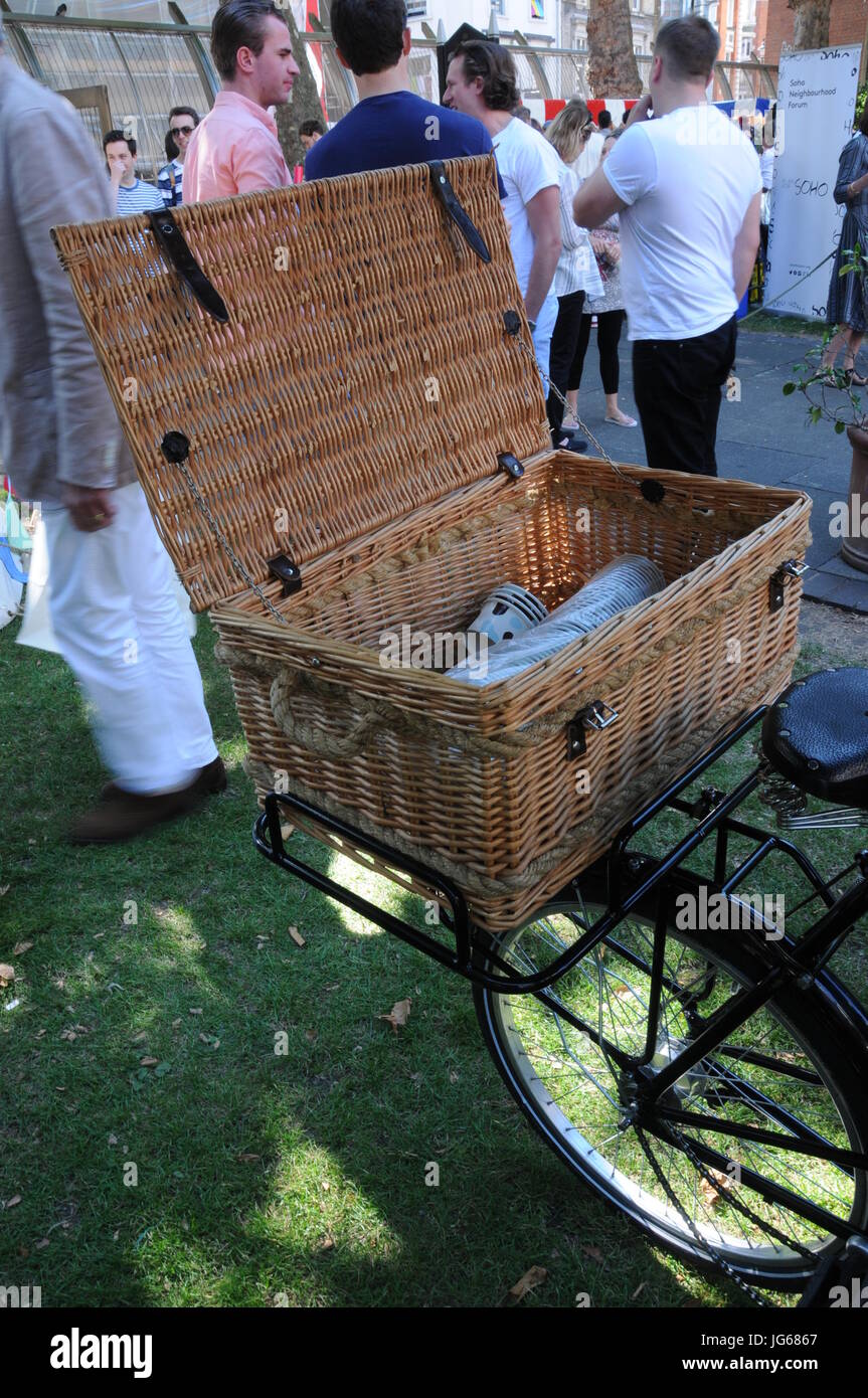 Bicycle and wicker basket, at the Soho village fete, London Stock Photo