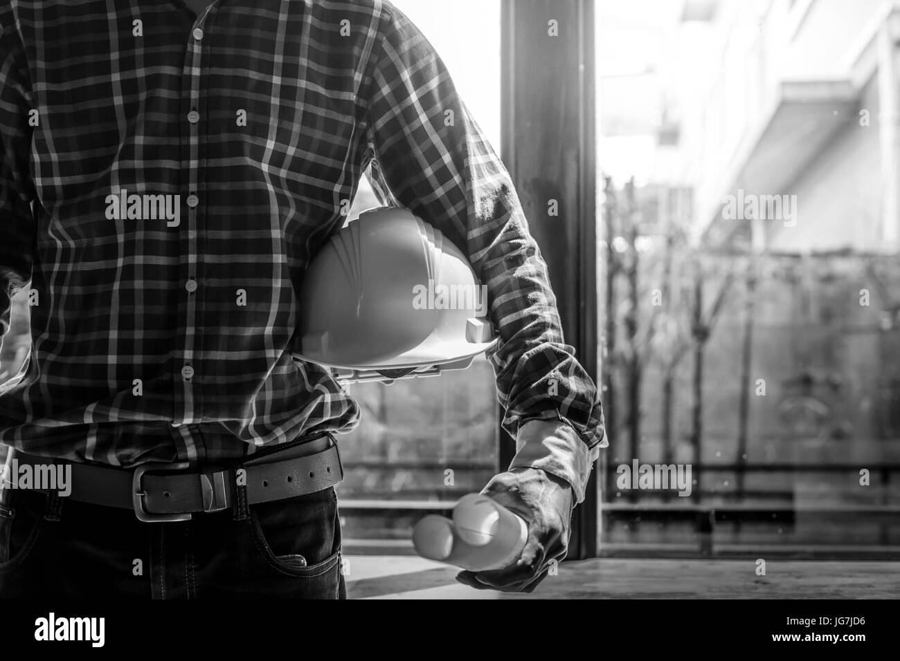 Smart Businessman holding construction helmet and blueprints in retro style Stock Photo Alamy