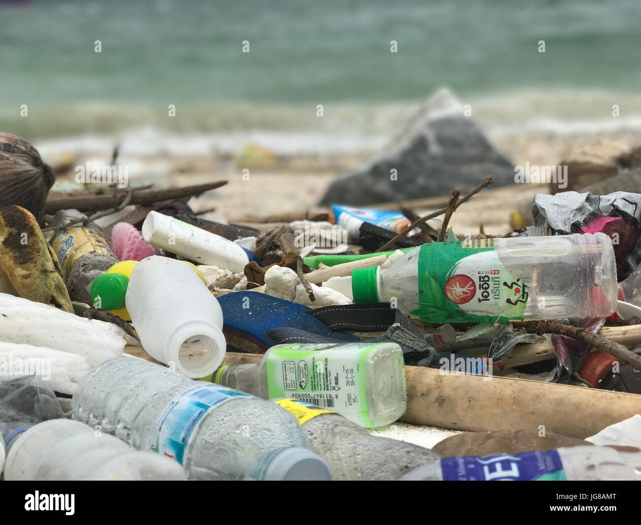 Plastic trash lying on a beach in Ko Sih Chang, an island in the Gulf of Thailand, 06 June 2017. The G20 summit in Hamburg will also deal with the problem of plastic trash in the world's oceans. For many this is only a theoretical problem but in Thailand's beaches it is possible to see how big the problem has already become. Photo: Christoph Sator/dpa Stock Photo