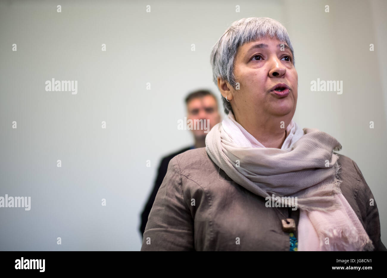 Seyran Ates, co-founder and idea provider of the liberal mosque, speaks to journalists during a visit of Cem Oezdemir, federal chairman of the Buendnis 90/Die Gruenen party, to the Ibn Rushd-Goethe Mosque in Berlin, Germany, 4 July 2017. The mosque founded in June 2017 does not have its own building, instead it uses a room in an attached building of the protestant St. Johannis church in the district of Moabit in Berlin. The new mosque offers a space for joint prayers for men and women as well as Sunnites, Schiites and Alevis. Photo: Bernd von Jutrczenka/dpa Stock Photo