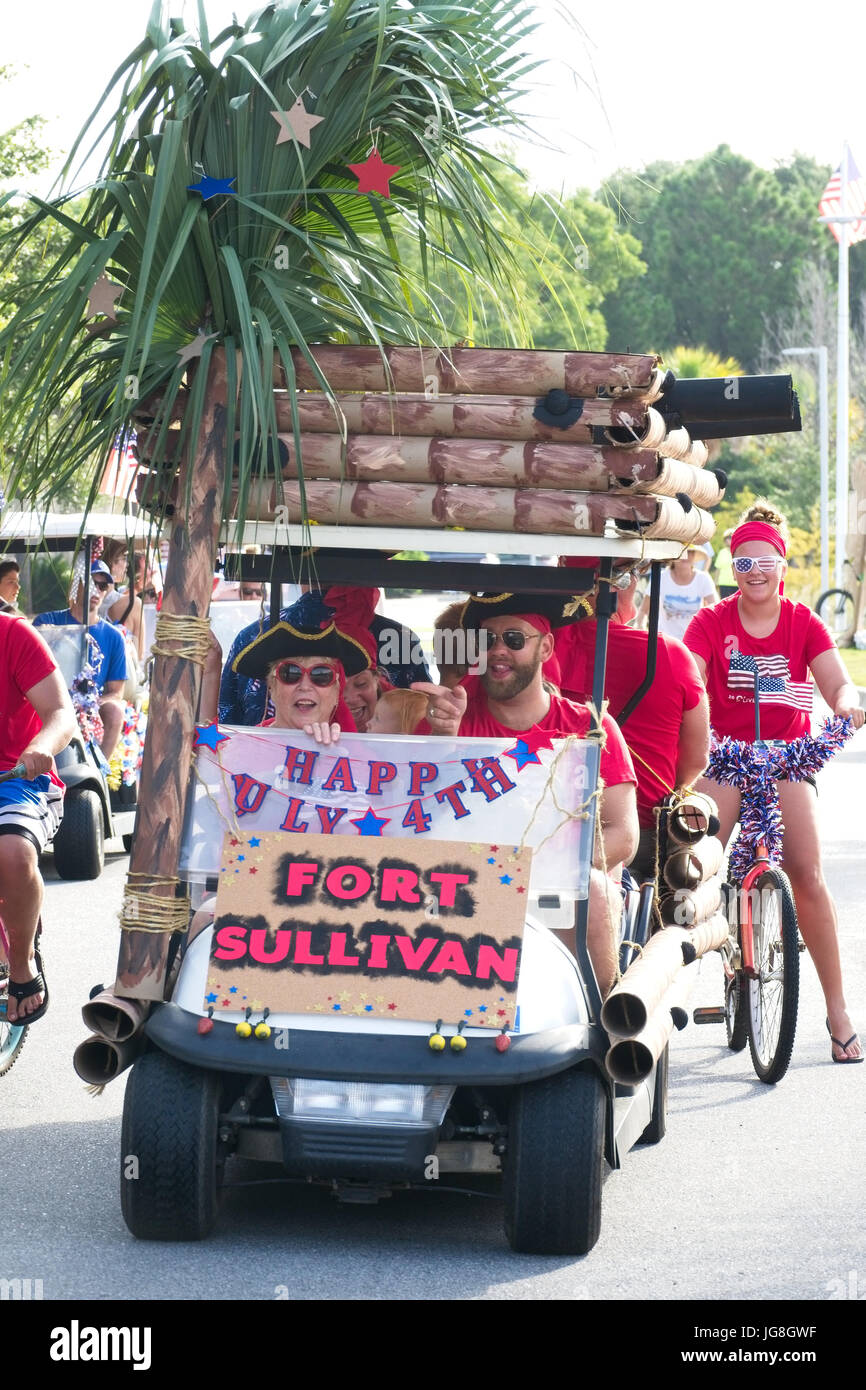 Sullivan's Island, South Carolina, USA. 4th July, 2017. A group dressed as pirates rides along in a golf cart decorated as Fort Sullivan during the annual Sullivan's Island Independence Day parade July 4, 2017 in Sullivan's Island, South Carolina. The tiny affluent sea island was once the home of pirates and later military forts that were instrumental in both the Revolutionary and Civil Wars. Credit: Planetpix/Alamy Live News Stock Photo