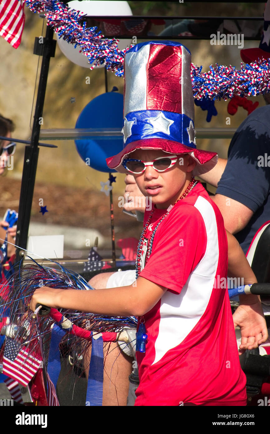 Sullivan's Island, South Carolina, USA. 4th July, 2017. A young boy dressed in patriotic colors during the annual Sullivan's Island Independence Day parade July 4, 2017 in Sullivan's Island, South Carolina. The tiny affluent sea island hosts a bicycle and golf cart parade through the historic village. Credit: Planetpix/Alamy Live News Stock Photo