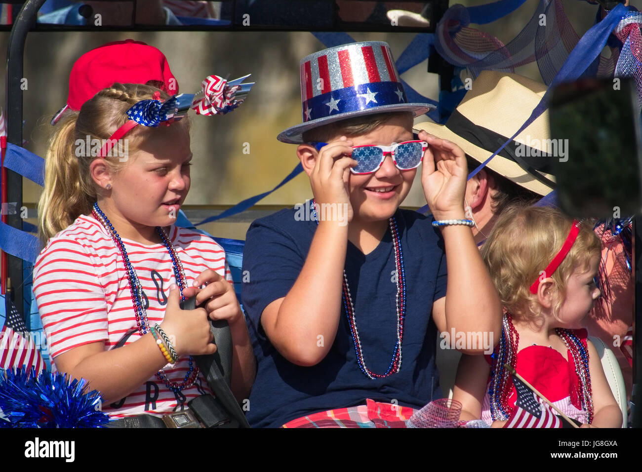 Sullivan's Island, South Carolina, USA. 4th July, 2017. A group of young children dressed in patriotic colors during the annual Sullivan's Island Independence Day parade July 4, 2017 in Sullivan's Island, South Carolina. The tiny affluent sea island hosts a bicycle and golf cart parade through the historic village. Credit: Planetpix/Alamy Live News Stock Photo