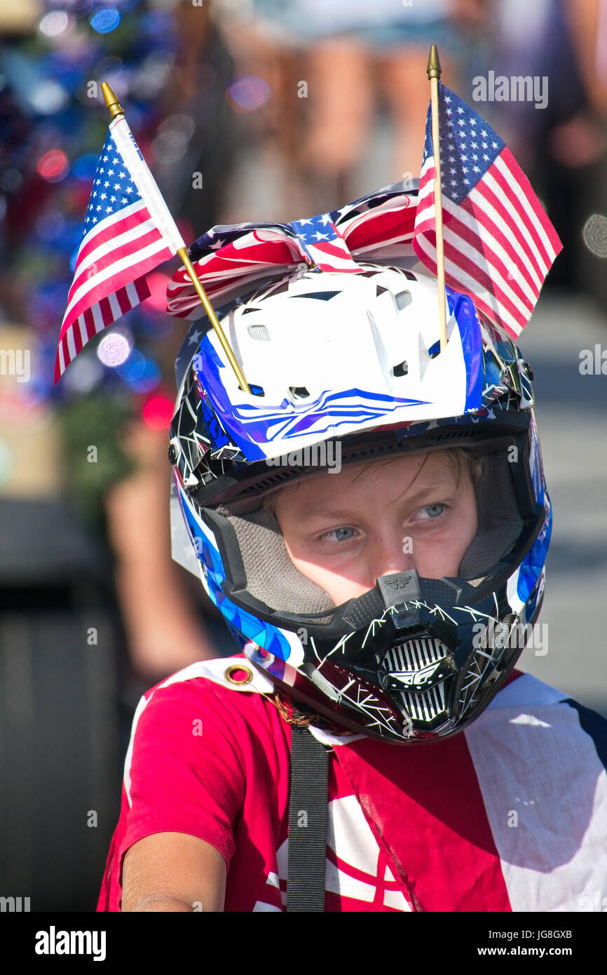 Sullivan's Island, South Carolina, USA. 4th July, 2017. A young boy dressed in patriotic colors during the annual Sullivan's Island Independence Day parade July 4, 2017 in Sullivan's Island, South Carolina. The tiny affluent sea island hosts a bicycle and golf cart parade through the historic village. Credit: Planetpix/Alamy Live News Stock Photo