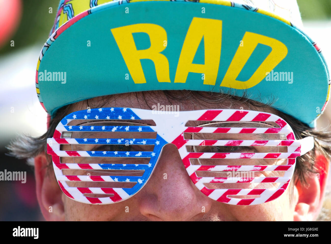 Sullivan's Island, South Carolina, USA. 4th July, 2017. A man shows off his stars and stripes glasses during the annual Sullivan's Island Independence Day parade July 4, 2017 in Sullivan's Island, South Carolina. The tiny affluent sea island hosts a bicycle and golf cart parade through the historic village. Credit: Planetpix/Alamy Live News Stock Photo