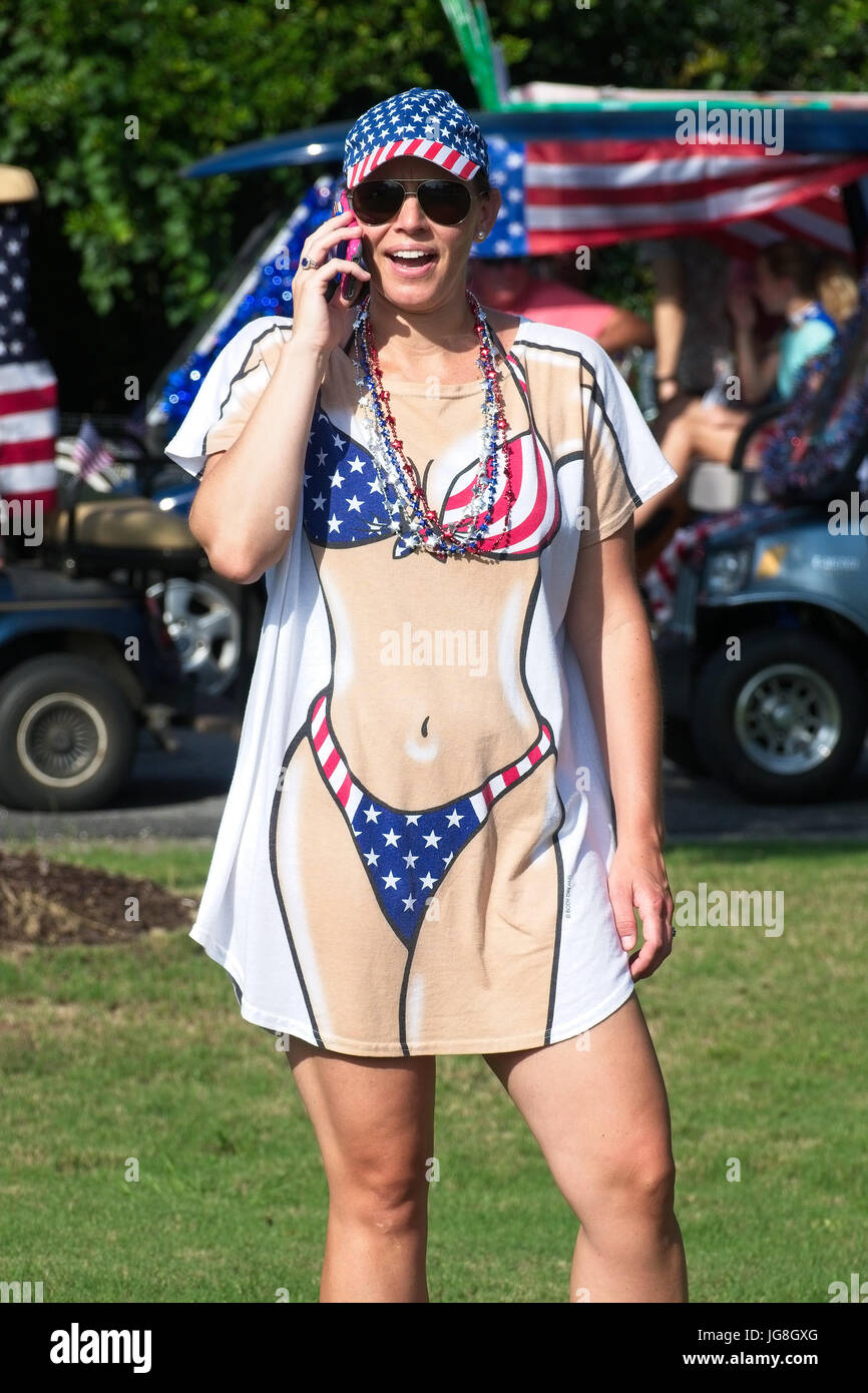 Sullivan's Island, South Carolina, USA. 4th July, 2017. A women wearing a costume during the annual Sullivan's Island Independence Day parade July 4, 2017 in Sullivan's Island, South Carolina. The tiny affluent sea island hosts a bicycle and golf cart parade through the historic village. Credit: Planetpix/Alamy Live News Stock Photo