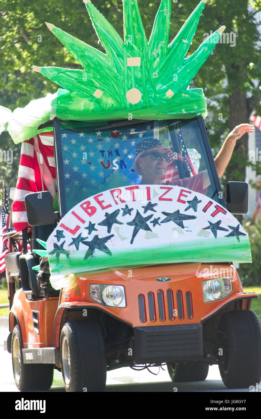 Sullivan's Island, South Carolina, USA. 4th July, 2017. A man rides a pro-marijuana decorated golf cart during the annual Sullivan's Island Independence Day parade July 4, 2017 in Sullivan's Island, South Carolina. The tiny affluent sea island hosts a bicycle and golf cart parade through the historic village. Credit: Planetpix/Alamy Live News Stock Photo