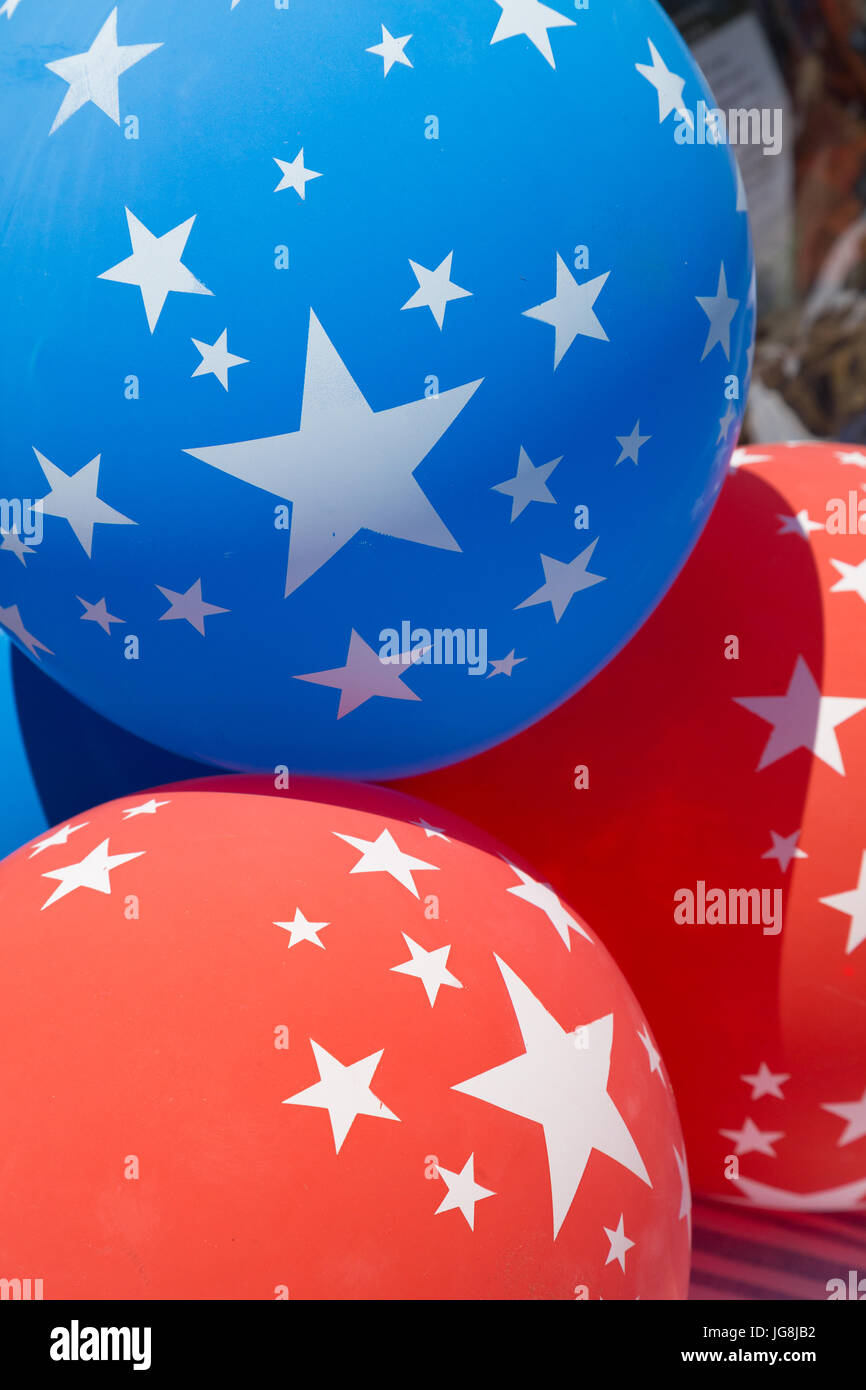 Blue and red balloons with white stars at a 4th of July party Credit: Kayte Deioma/Alamy Live News Stock Photo