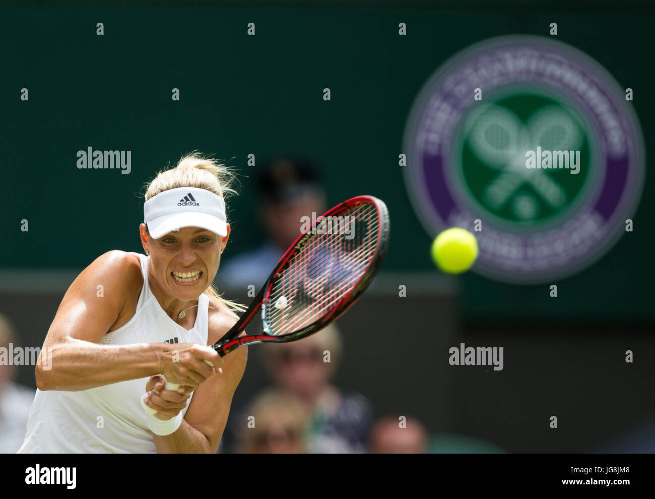 London, Britain. 4th July, 2017. Angelique Kerber of Germany hits a return during the women's singles first round match against Irina Falconi of the United States at the Championship Wimbledon 2017 in London, Britain, on July 4, 2017. Kerber won 2-0. Credit: Jin Yu/Xinhua/Alamy Live News Stock Photo