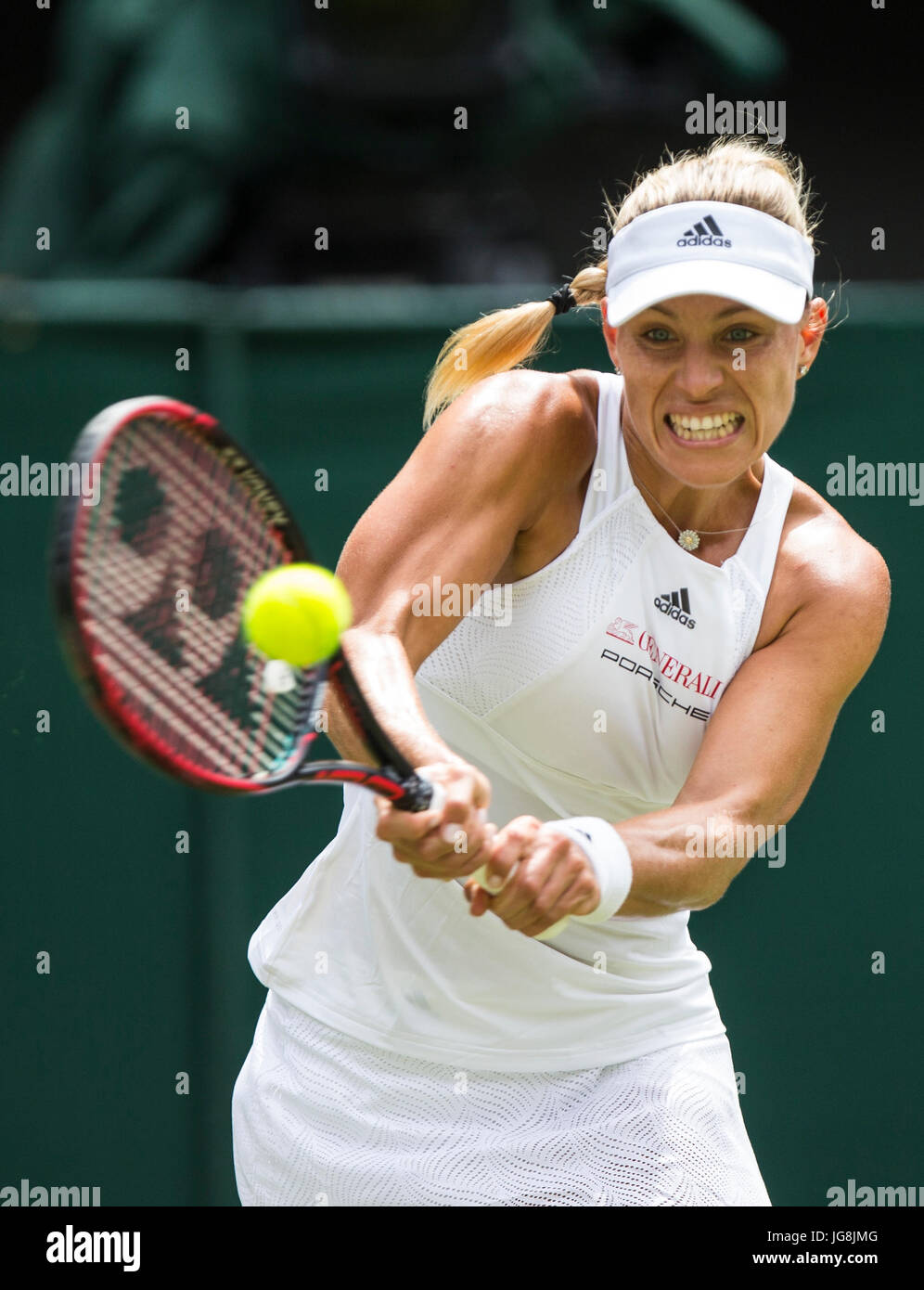 London, Britain. 4th July, 2017. Angelique Kerber of Germany hits a return during the women's singles first round match against Irina Falconi of the United States at the Championship Wimbledon 2017 in London, Britain, on July 4, 2017. Kerber won 2-0. Credit: Jin Yu/Xinhua/Alamy Live News Stock Photo