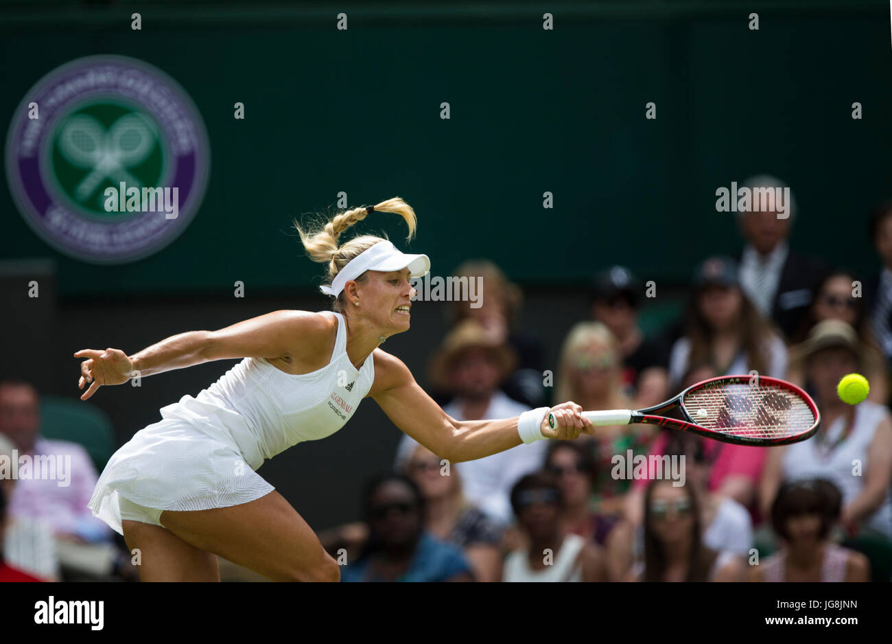 London, Britain. 4th July, 2017. Angelique Kerber of Germany hits a return during the women's singles first round match against Irina Falconi of the United States at the Championship Wimbledon 2017 in London, Britain, on July 4, 2017. Kerber won 2-0. Credit: Jin Yu/Xinhua/Alamy Live News Stock Photo